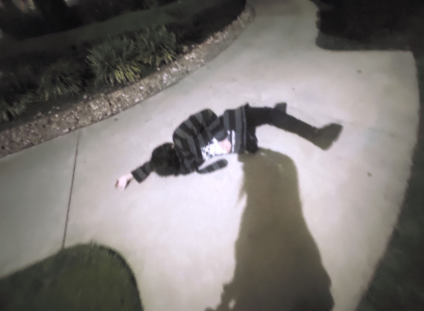 an image of tkr laying on the concrete in the family guy death pose.